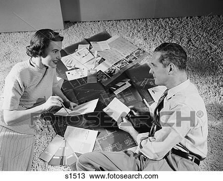 1950S Couple Man Woman Sitting Floor Looking At Plans For New House View Large Photo Image Stock Image - 1950S Couple Man Woman Sitting Floor Looking At Plans For New House . Fotosearch