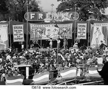 1950S Crowd Gathered In Front Of Stage At County Fair Freak Show View Large Photo Image Stock Photo - 1950S Crowd Gathered In Front Of Stage At County Fair Freak Show . Fotosearch