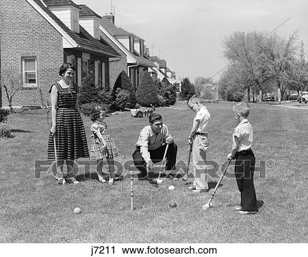 1950S Family Mother Father 3 Children Playing Croquet Front Lawn Suburban Home View Large Photo Image Stock Image - 1950S Family Mother Father 3 Children Playing Croquet Front Lawn Suburban Home. Fotosearch