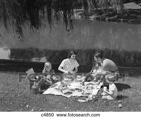 1950S Family Mother Father Son Daughter Picnicking By Lake Outdoor View Large Photo Image Stock Image - 1950S Family Mother Father Son Daughter Picnicking By Lake Outdoor. Fotosearch