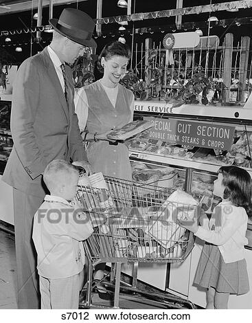 1950S Family Of 4 Inside Supermarket Father Pushing Cart Mother 2 Kids View Large Photo Image Stock Image - 1950S Family Of 4 Inside Supermarket Father Pushing Cart Mother 2 Kids . Fotosearch
