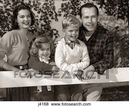 Stock Photo - 1950S Family Outside Smiling Mother Father Son Daughter. Fotosearch