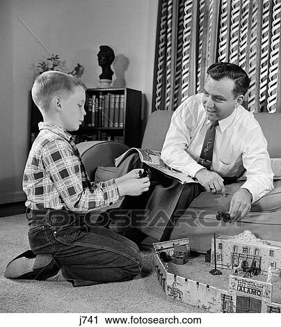 1950S Father And Son Playing With Cowboy Toy Game In Living Room Indoor View Large Photo Image Stock Image - 1950S Father And Son Playing With Cowboy Toy Game In Living Room Indoor. Fotosearch