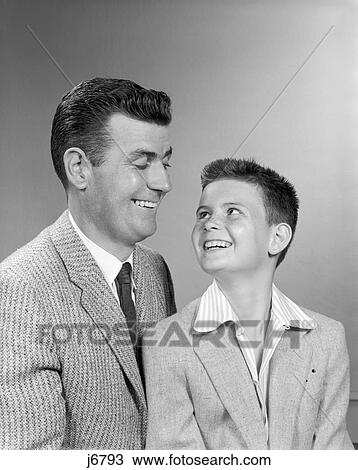 1950S Father Smiling At Son Studio Portrait View Large Photo Image Stock Image - 1950S Father Smiling At Son Studio Portrait. Fotosearch