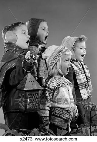 1950S Four Children Two Boys Two Girls Singing Christmas Carol Together Holding Candle Lantern View Large Photo Image Stock Image - 1950S Four Children Two Boys Two Girls Singing Christmas Carol Together Holding Candle Lantern. Fotosearch