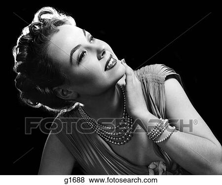 1950S Glamorous Woman Wearing Four Strand Pearl Necklace And Matching Bracelet View Large Photo Image Stock Photo - 1950S Glamorous Woman Wearing Four Strand Pearl Necklace And Matching Bracelet . Fotosearch
