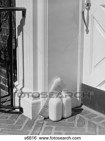 1950S Glass Milk Bottles And Newspaper By Front Door Home Delivery View Large Photo Image Stock Photograph - 1950S Glass Milk Bottles And Newspaper By Front Door Home Delivery. Fotosearch