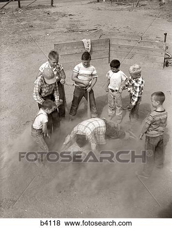 1950S Group Boys Sand Lot Baseball 2 Boys On Ground Fighting In Dust Others Watching Fight Argue Violence Game View Large Photo Image Stock Photo - 1950S Group Boys Sand Lot Baseball 2 Boys On Ground Fighting In Dust Others Watching Fight Argue Violence Game. Fotosearch