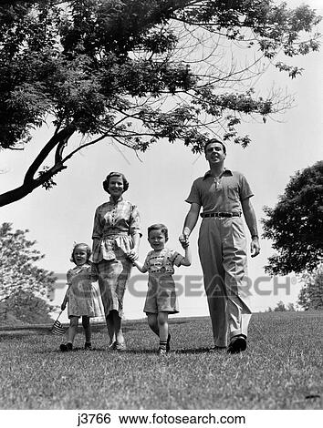 1950S Happy Family Mother Father Daughter Son Walking In Park View Large Photo Image Stock Photograph - 1950S Happy Family Mother Father Daughter Son Walking In Park. Fotosearch
