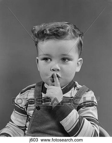 1950S Little Boy Making Shush Shushing Quiet Silence Sign With Finger To Mouth Lips View Large Photo Image Stock Image - 1950S Little Boy Making Shush Shushing Quiet Silence Sign With Finger To Mouth Lips. Fotosearch
