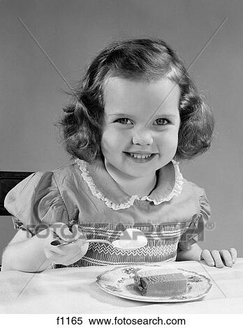 Stock Photography - 1950S Little Girl Eating Ice Cream Smiling. Fotosearch
