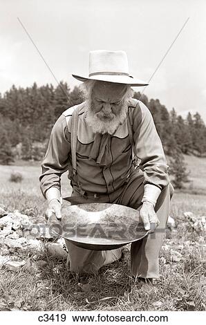 1950S Male Prospector Panning For Gold View Large Photo Image Stock Photo - 1950S Male Prospector Panning For Gold. Fotosearch