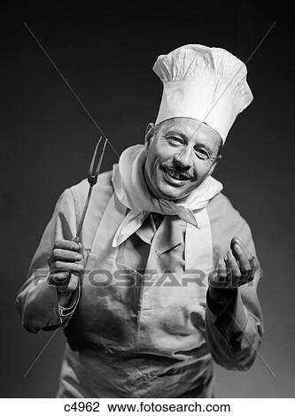 Stock Image - 1950S Man Chef Smiling With Expressive Hands Looking At Camera Indoor. Fotosearch