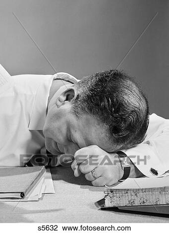 1950S Man With Head On Desk In Frustration Exhaustion View Large Photo Image Stock Image - 1950S Man With Head On Desk In Frustration Exhaustion. Fotosearch