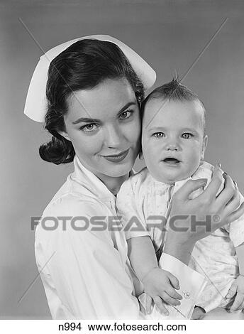 1950S Nurse Holding Baby Infant View Large Photo Image Picture - 1950S Nurse Holding Baby Infant. Fotosearch