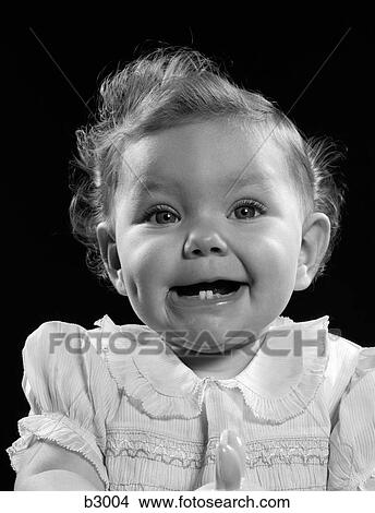 Picture - 1950S Portrait Baby Girl Smiling With Two Bottom Teeth Showing. Fotosearch