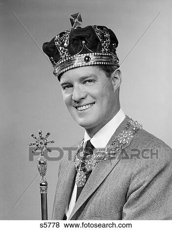 1950S Portrait Of Man Wearing A King'S Crown And Holding A Scepter While Smiling View Large Photo Image Stock Photo - 1950S Portrait Of Man Wearing A King'S Crown And Holding A Scepter While Smiling. Fotosearch