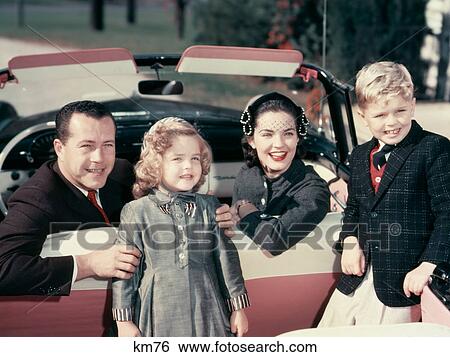 1950S Portrait Smiling Family Father Mother Son Daughter Sitting In Red White Convertible Automobile View Large Photo Image Stock Photograph - 1950S Portrait Smiling Family Father Mother Son Daughter Sitting In Red White Convertible Automobile. Fotosearch