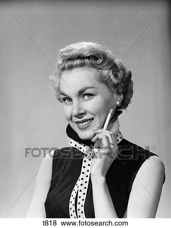1950S Smiling Blonde Woman Polka Dot Neck Tie Holding Cigarette View Large Photo Image Stock Photo - 1950S Smiling Blonde Woman Polka Dot Neck Tie Holding Cigarette. Fotosearch