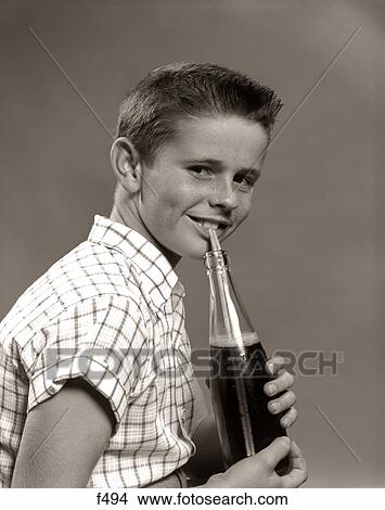 1950S Smiling Boy Drinking Carbonated Beverage From Soda Pop Bottle With Straw View Large Photo Image Picture - 1950S Smiling Boy Drinking Carbonated Beverage From Soda Pop Bottle With Straw. Fotosearch
