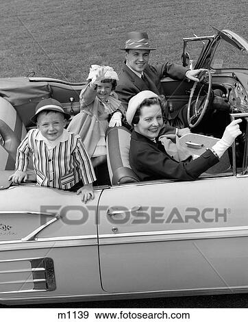 1950S Smiling Family Portrait Mother Father Son Daughter In Chevrolet Convertible Automobile View Large Photo Image Stock Photo - 1950S Smiling Family Portrait Mother Father Son Daughter In Chevrolet Convertible Automobile. Fotosearch