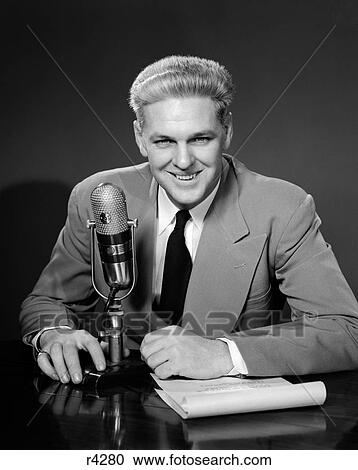 1950S Smiling Man Radio Announcer Newscaster Sitting Speaking At Microphone Studio Indoor View Large Photo Image Stock Image - 1950S Smiling Man Radio Announcer Newscaster Sitting Speaking At Microphone Studio Indoor. Fotosearch
