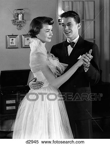1950S Smiling Teenage Couple In Formal Evening Wear Dancing Indoors View Large Photo Image Stock Photography - 1950S Smiling Teenage Couple In Formal Evening Wear Dancing Indoors. Fotosearch