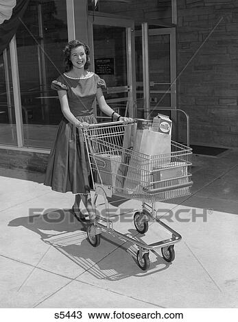 1950S Smiling Woman Pushing Grocery Cart Out Of Supermarket View Large Photo Image Stock Image - 1950S Smiling Woman Pushing Grocery Cart Out Of Supermarket. Fotosearch