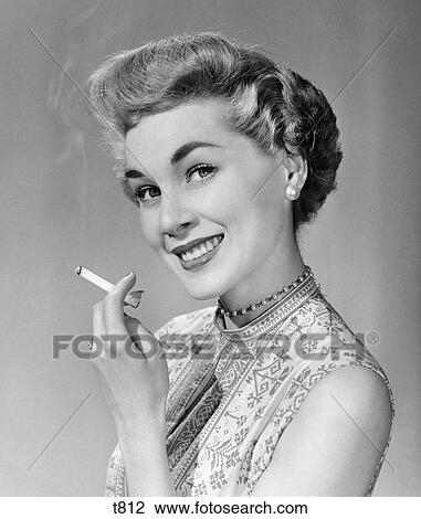1950s Smiling Woman Short Fashionable Hairstyle Holding Cigarette