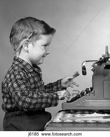 1950S Smiling Young Boy Typing On Typewriter View Large Photo Image Stock Photography - 1950S Smiling Young Boy Typing On Typewriter. Fotosearch