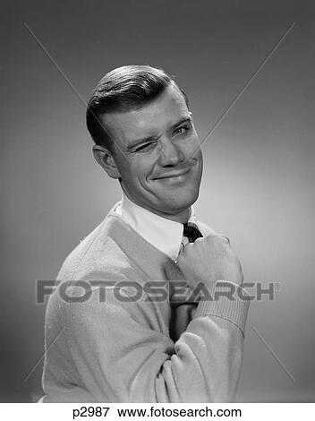 1950S Smiling Young Man Winking Right Eye And Pointing Proudly To Himself Looking At Camera View Large Photo Image Stock Photo - 1950S Smiling Young Man Winking Right Eye And Pointing Proudly To Himself Looking At Camera. Fotosearch