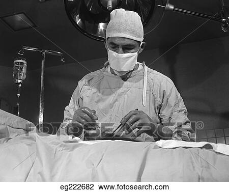 1950S Surgeon Standing Inside Operating Room About To Operate On Patient View Large Photo Image Stock Image - 1950S Surgeon Standing Inside Operating Room About To Operate On Patient. Fotosearch