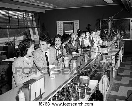 1950S Teenagers Sitting At Soda Fountain Counter View Large Photo Image Stock Image - 1950S Teenagers Sitting At Soda Fountain Counter. Fotosearch