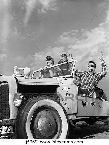 1950S Teens In Roofless Hotrod With Graffiti Atom & Eve No Kissing Etc View Large Photo Image Stock Photo - 1950S Teens In Roofless Hotrod With Graffiti Atom & Eve No Kissing Etc. Fotosearch
