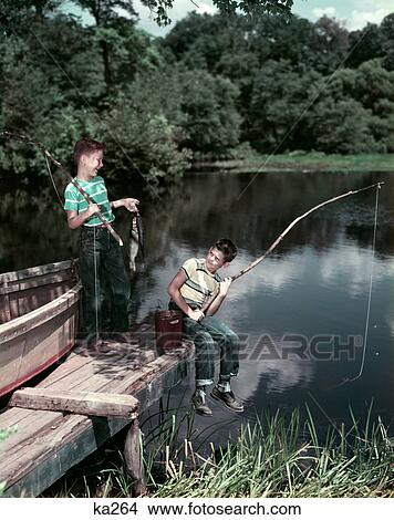 1950S Two Boys Fishing In Lake From Dock Outdoor View Large Photo Image Picture - 1950S Two Boys Fishing In Lake From Dock Outdoor . Fotosearch