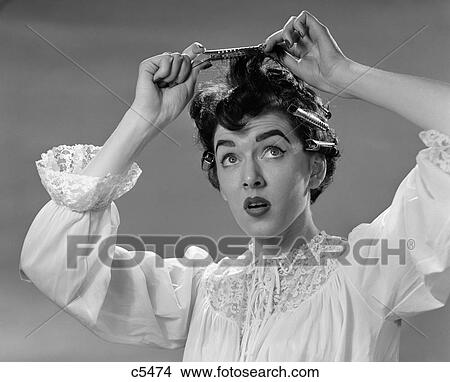 1950S Woman In Nightgown Putting Roller Clips In Hair View Large Photo Image Picture - 1950S Woman In Nightgown Putting Roller Clips In Hair. Fotosearch