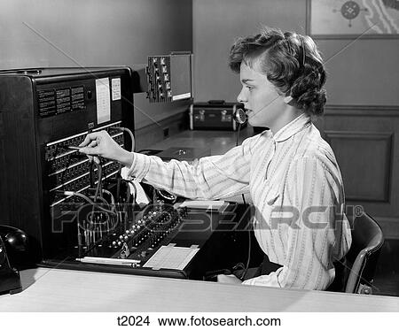 Picture - 1950S Woman Office Telephone Switchboard Receptionist Operator Wearing Headset Answering Transferring Call . Fotosearch