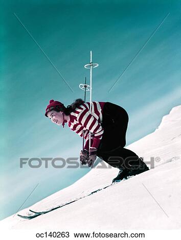 1950S Woman Skiing Downhill Wearing Red White Striped Sweater Hat Gloves View Large Photo Image Stock Image - 1950S Woman Skiing Downhill Wearing Red White Striped Sweater Hat Gloves. Fotosearch
