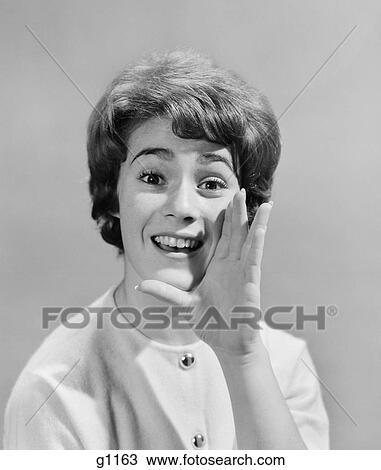 1950S Woman Yelling With Hand Held Up To Her Face View Large Photo Image Stock Image - 1950S Woman Yelling With Hand Held Up To Her Face. Fotosearch