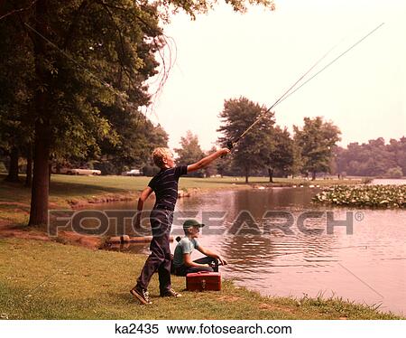 1960S 1970S Boys Fishing Casting Casting Into Pond View Large Photo Image Stock Photography - 1960S 1970S Boys Fishing Casting Casting Into Pond. Fotosearch