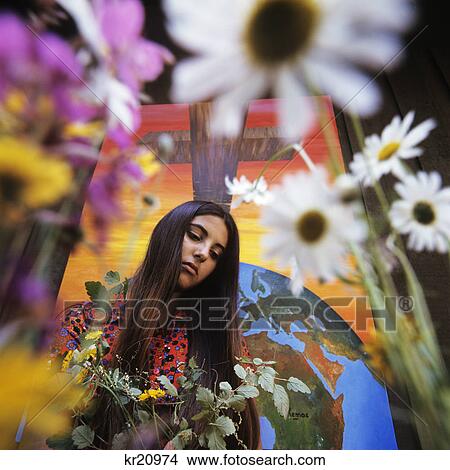 Picture - 1960S 1970S Moody Brunette Girl Daisies And Christain Cross Crucifix. Fotosearch