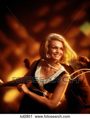 1960S 1970S Smiling Blond Woman Dancing In Disco Strand Of Pearls Swinging View Large Photo Image Stock Image - 1960S 1970S Smiling Blond Woman Dancing In Disco Strand Of Pearls Swinging . Fotosearch