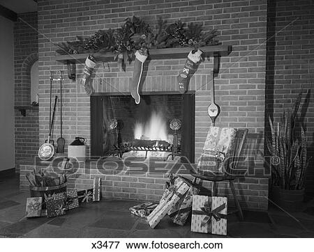 1960S 1970S Stockings Hung By Fireplace And Wrapped Christmas Presents View Large Photo Image Stock Photo - 1960S 1970S Stockings Hung By Fireplace And Wrapped Christmas Presents. Fotosearch