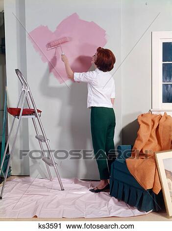 1960S 1970S Woman Painting Wall With Paint Roller Indoor View Large Photo Image Stock Image - 1960S 1970S Woman Painting Wall With Paint Roller Indoor . Fotosearch