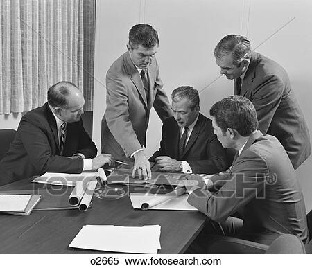 1960S 5 Executive Businessmen At Conference Table Meeting Looking Over Papers & Blueprints View Large Photo Image Stock Photography - 1960S 5 Executive Businessmen At Conference Table Meeting Looking Over Papers & Blueprints. Fotosearch