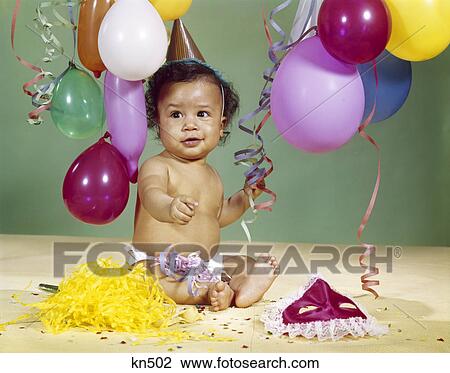 1960S African-American Baby Boy Wearing Party Hat With Balloons Streamers Around View Large Photo Image Stock Image - 1960S African-American Baby Boy Wearing Party Hat With Balloons Streamers Around. Fotosearch