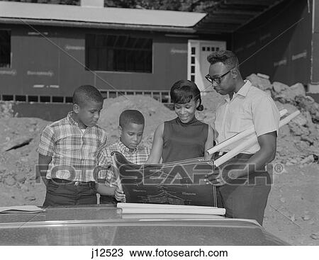 1960S African American Family Looking At Blueprints New House Construction View Large Photo Image Stock Image - 1960S African American Family Looking At Blueprints New House Construction. Fotosearch