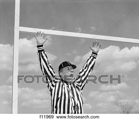 1960S American Football Referee Making Touchdown Hand Signal At Goal Post View Large Photo Image Stock Photo - 1960S American Football Referee Making Touchdown Hand Signal At Goal Post . Fotosearch