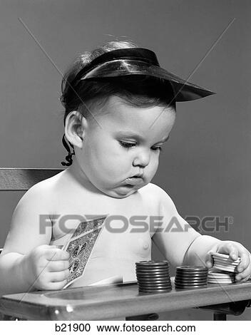 Stock Image - 1960S Baby Girl Playing With Cards Poker Chips Gambler Indoor. Fotosearch