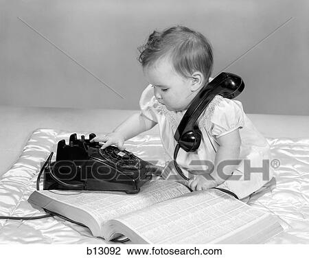 1960S Baby Girl With Telephone Book Dialing Rotary Telephone View Large Photo Image Stock Image - 1960S Baby Girl With Telephone Book Dialing Rotary Telephone. Fotosearch